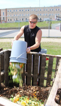 Students took turns hauling food waste from the cafeteria to the compost site.