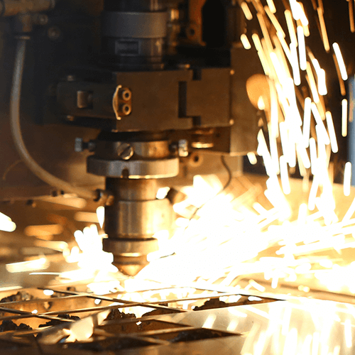 Sparks fly out machine head for metal processing.