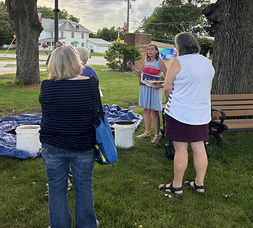 Jennifer Trent demonstrating proper compost moisture content