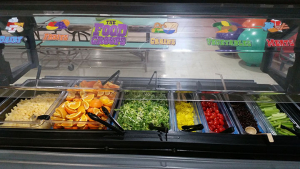 Students are able to select from a variety of fresh fruits and vegetables.