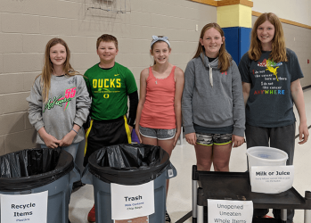 Melcher-Dallas students help their peers sort food waste
